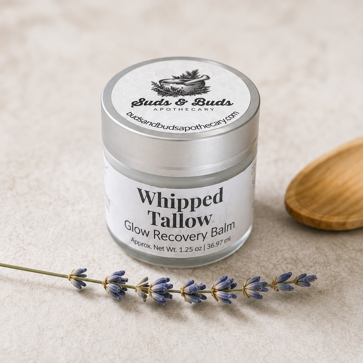 Glow Tallow Balm in a glass jar with lavender sprig from the Pure Radiance skincare gift collection